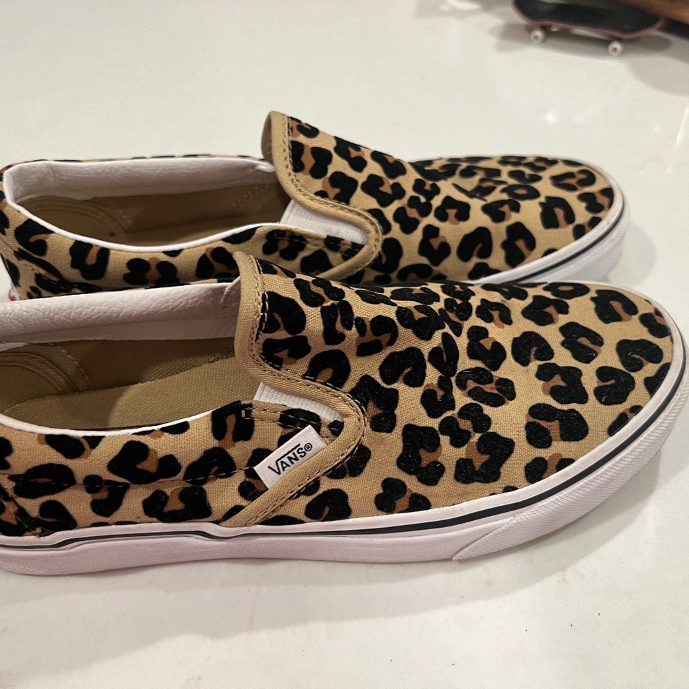 Vans leopard slip ons
